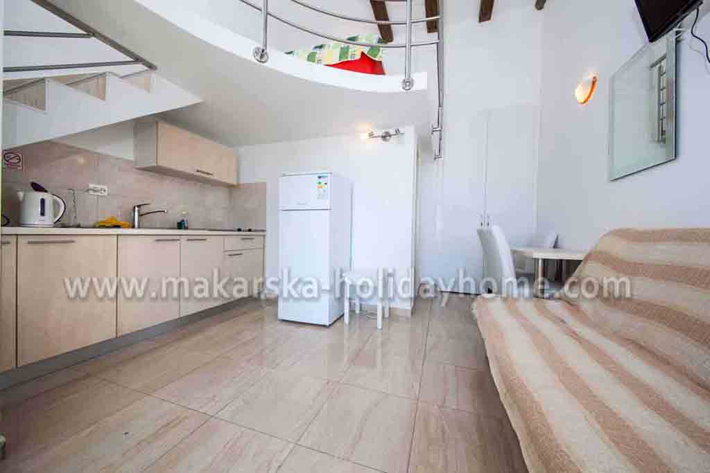 Wohnzimmer mit offener Küche - Appartement Boris A1 / 07